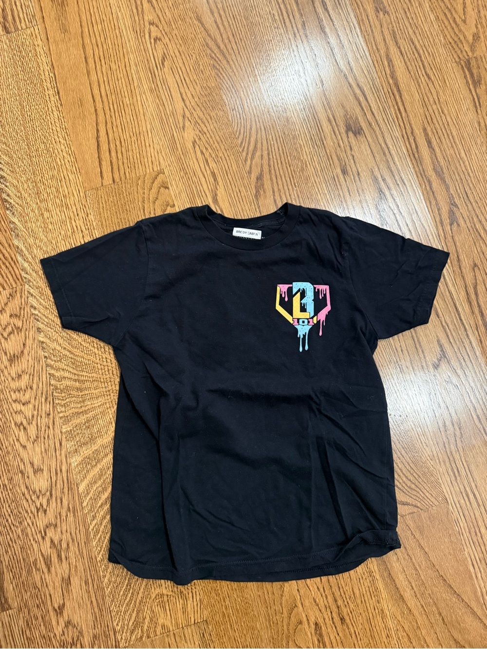 Kids Black Drip Logo Tee with Multicolor Accent
